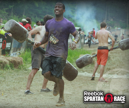 Malik Ranger runs the gauntlet of gladiators on his way to the finish line. 