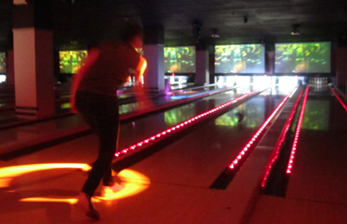 Catherine Carr takes the spotlight for the RANDy Rollers at the Corporate Bowling Showdown at Frames.