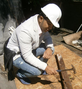 RAND intern Fahim Chowdhury examines a steel lintel.