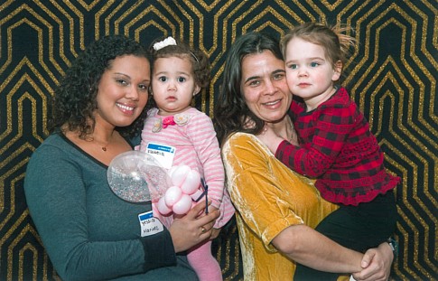 RAND coworkers Yessica Marinez and Sara Tsiropinas and their daughters Isabella and Maya enjoy a day of family fun with the UJA-Federation of New York.