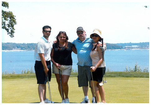 The RAND foursome of Luke, Joanna, John, and Sara are all smiles at Skyline's Smile Train golf outing.