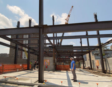 RAND Intern Andrew Miller on site observing the 7th floor steel framing of a new residential development under construction.