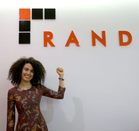 Senior Architect Esin Pektas, RA holds up her UP band in triumph. Her 677,841 steps raised $660 for WinNYC, her charity of choice.