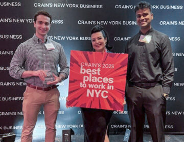 RAND Office Manager Jenny Derici and Client Services Associates Jackson Berns and Mark Bramlall accept the award on behalf of RAND at Crain's Best Places to Work in NYC award ceremony.