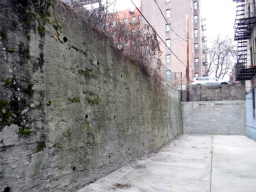 Failure to repair an unsafe condition in a retaining wall carries a $1,000 per month fine until corrected.