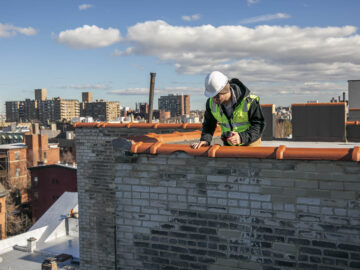 Engineering conducting a parapet inspection per New York City's new annual parapet inspection requirement.