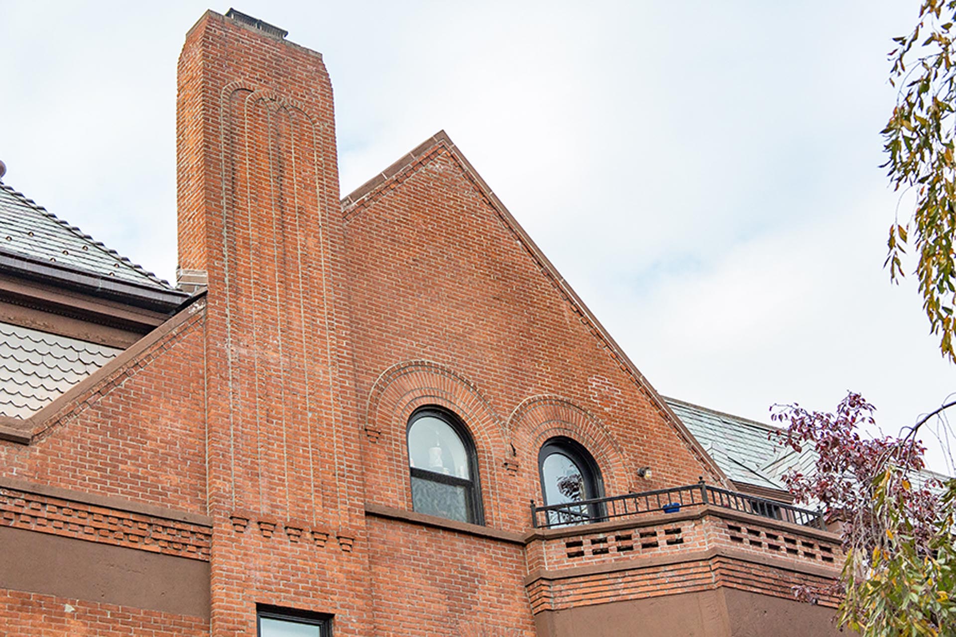 <p>Along the exterior elevations, defective exterior brickwork was replaced; eroded brickwork mortar joints were cut out and repointed; and a defective, leaking two-wythe thick brick stub parapet wall was removed and a new code-compliant stub parapet constructed.</p>
