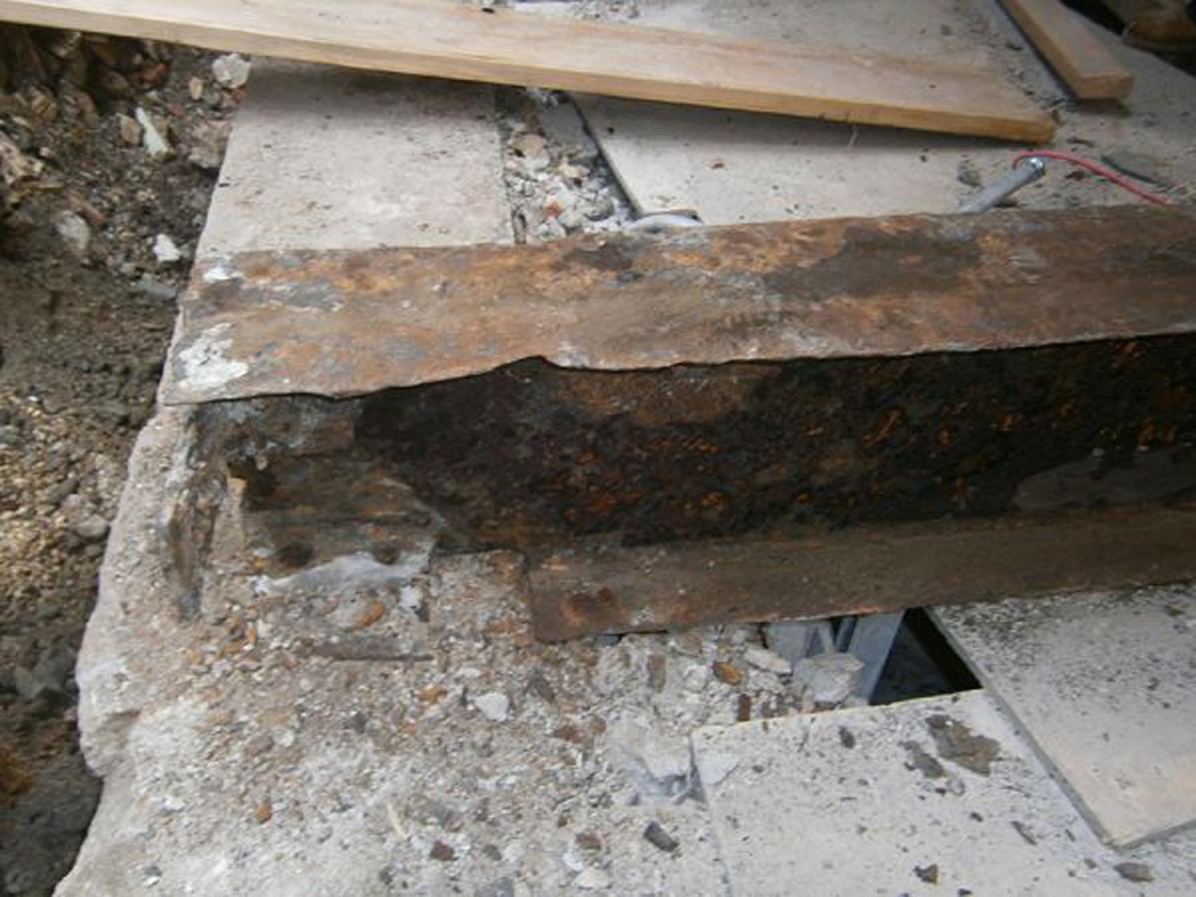 <p>One of the deteriorated steel beams that was uncovered when the concrete slab and beam encasement were removed.</p>
