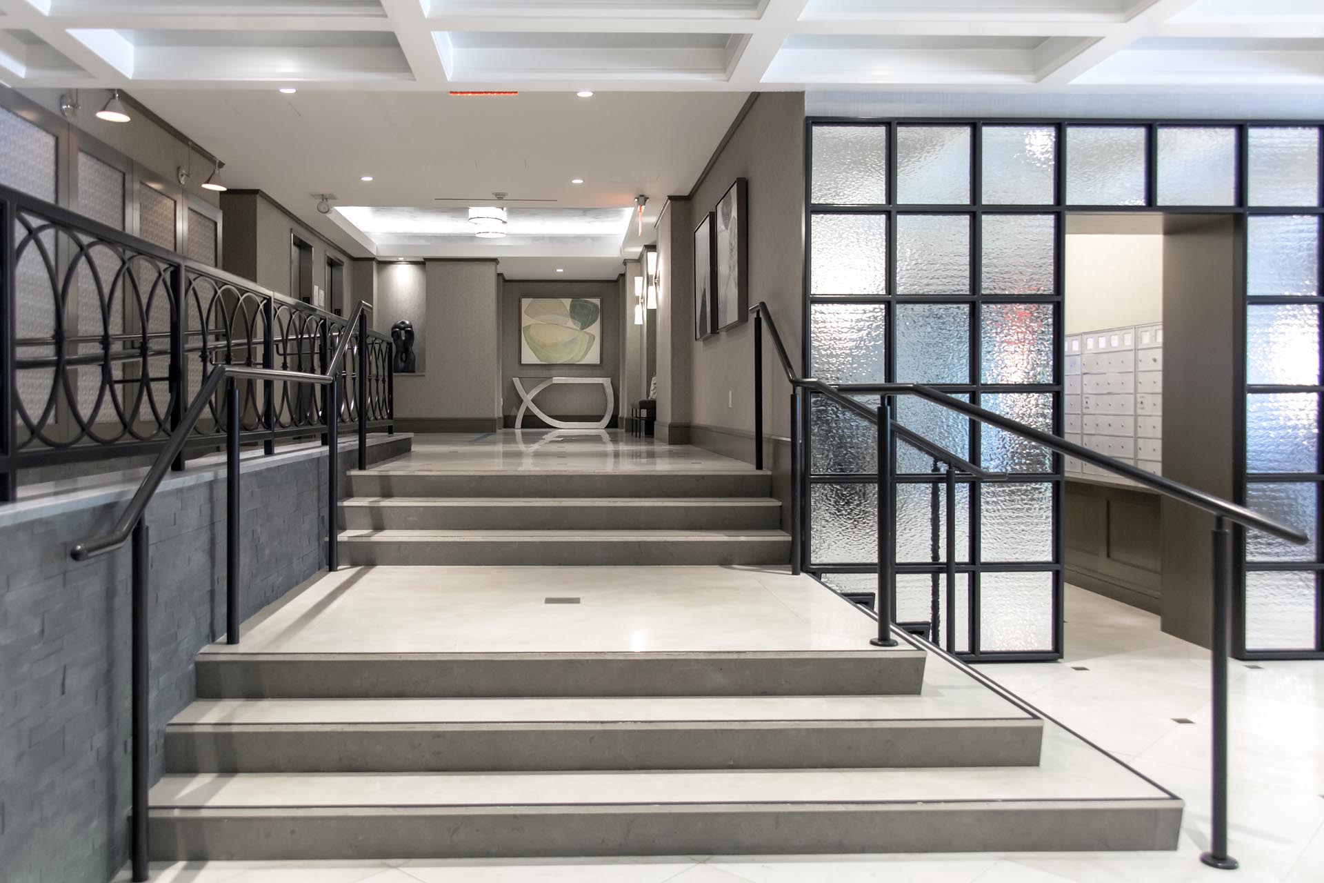 <p>Design and installation of new reinforced concrete slab-on-grade, concrete stair and modification of existing concrete ramp.</p>
