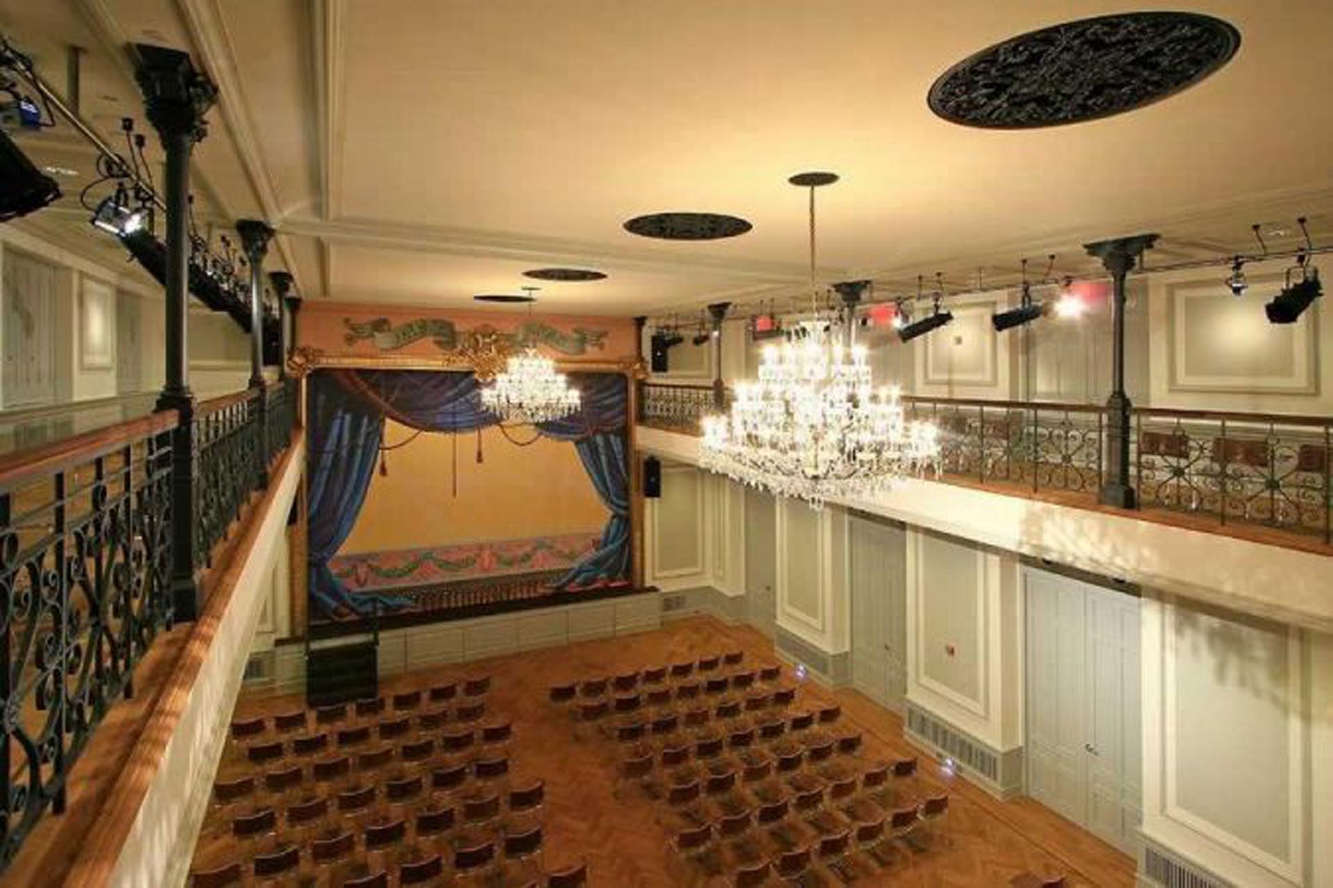 <p>The Grand Ballroom features a stage, balcony and skybox,crystal chandeliers, and stucco decorations throughout.</p>
