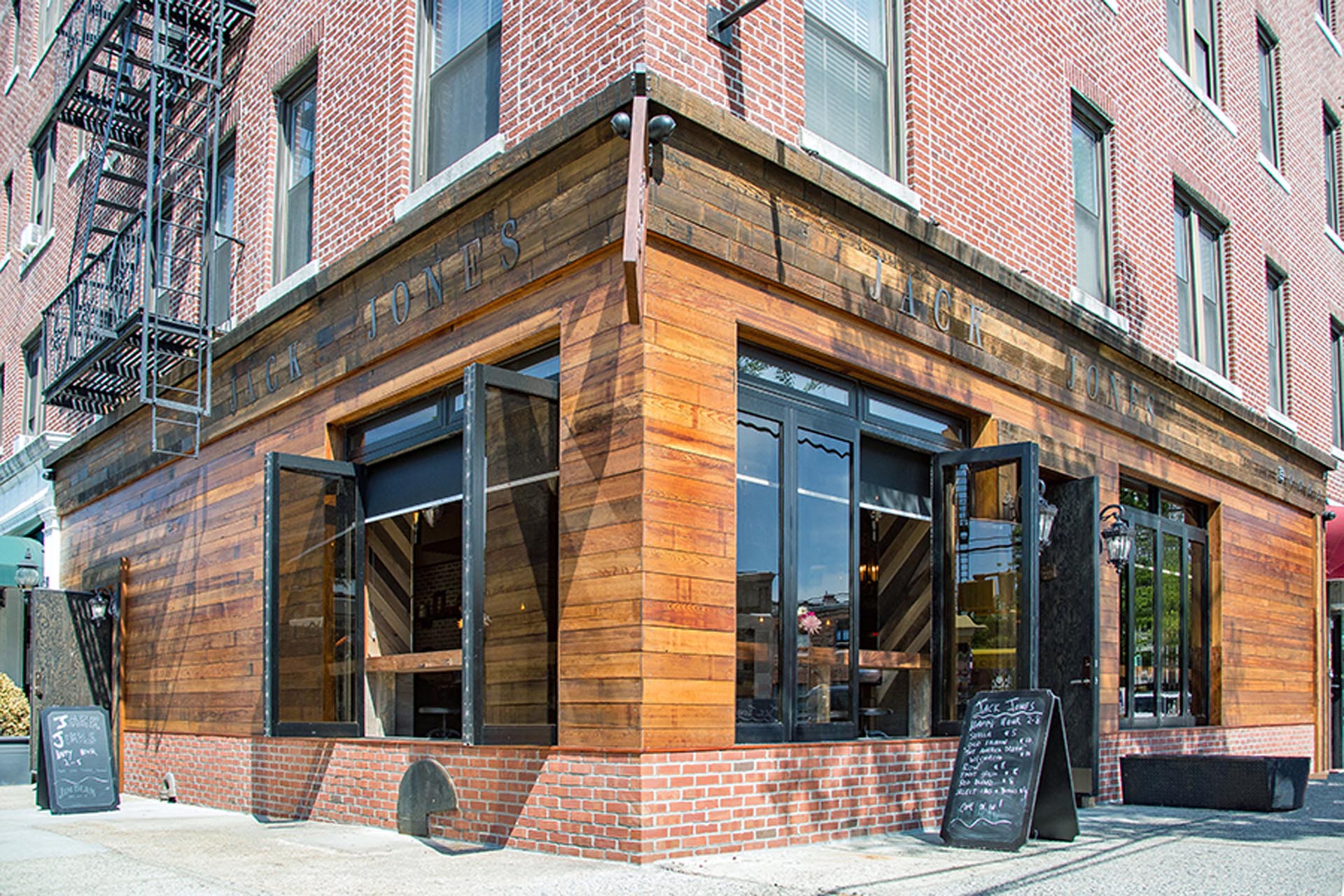 <p>Jack Jones’ storefront facade cladding is made of reclaimed cedar water tower lumber.</p>