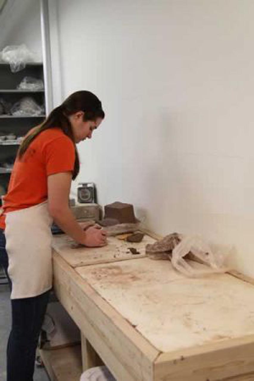 <p>A separate area with a slab roller and extruder is set up for handbuilding.</p>
