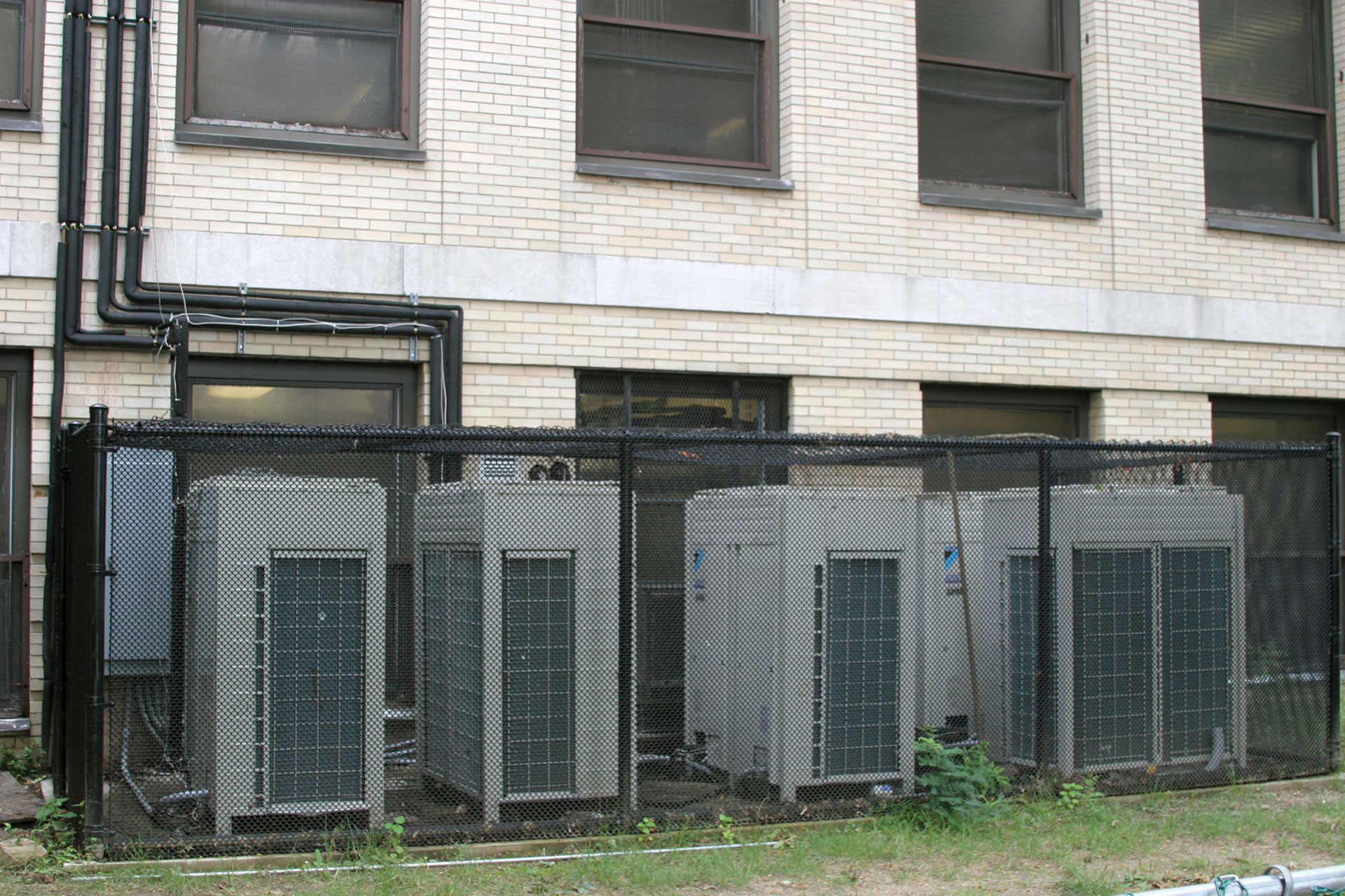 <p>High-efficiency HVAC condenser units installed outside the building<br />
increased the librarVs heating and cooling capacity.</p>