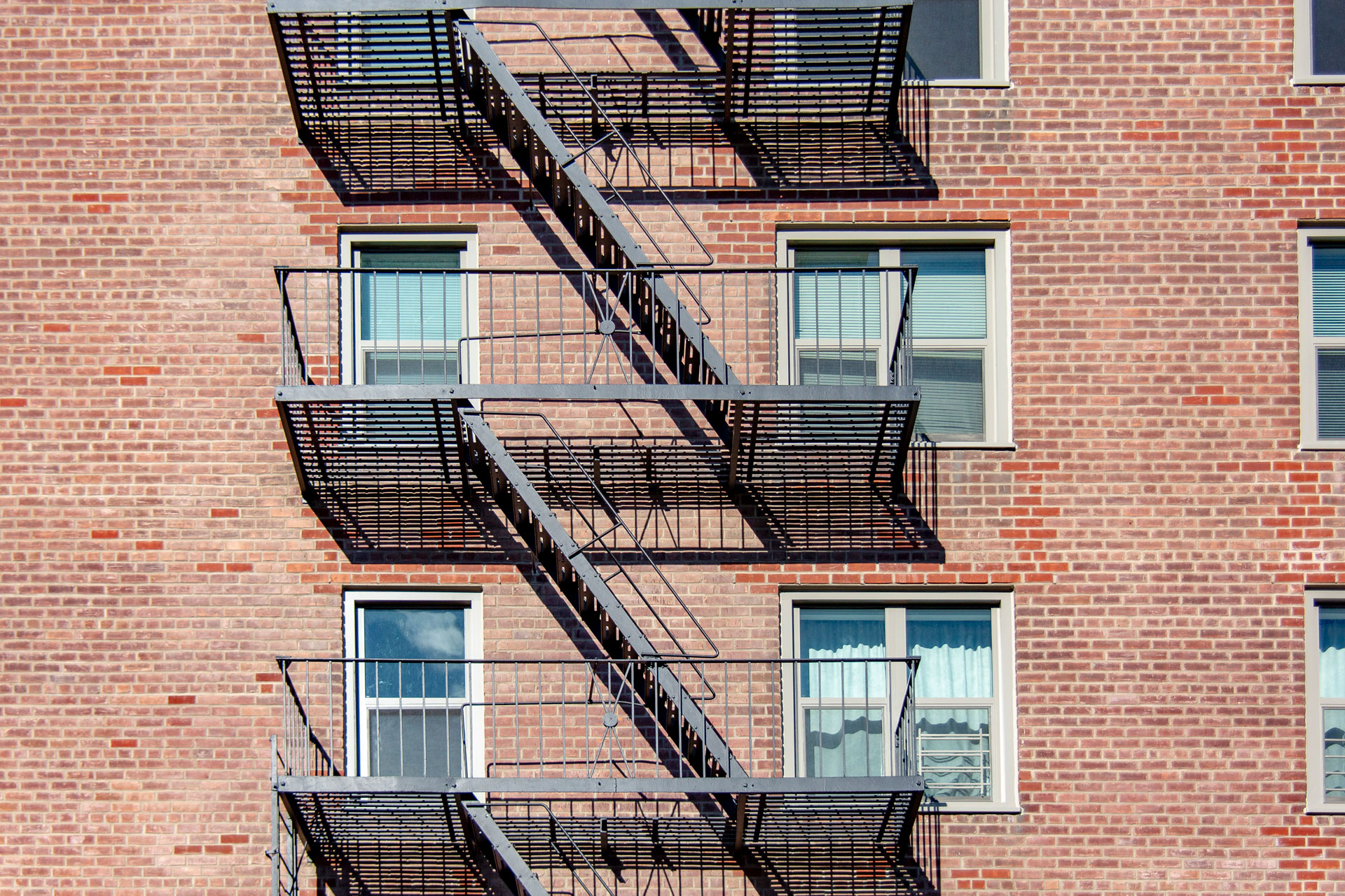 <p>Window replacement program involved installation of new energy efficient, fire-rated, and hurricane-grade window assemblies. Defective fire escape railings were replaced for all six buildings. </p>
