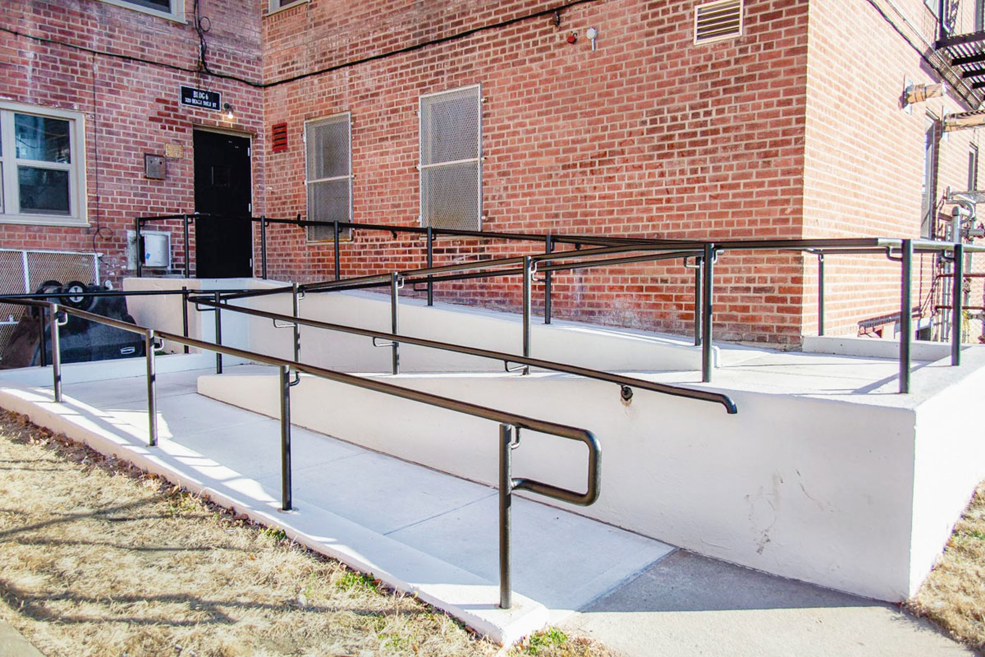 <p>Installation of new ADA-compliant concrete walkway and service ramp. </p>
