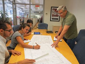 RAND employees in a development meeting.