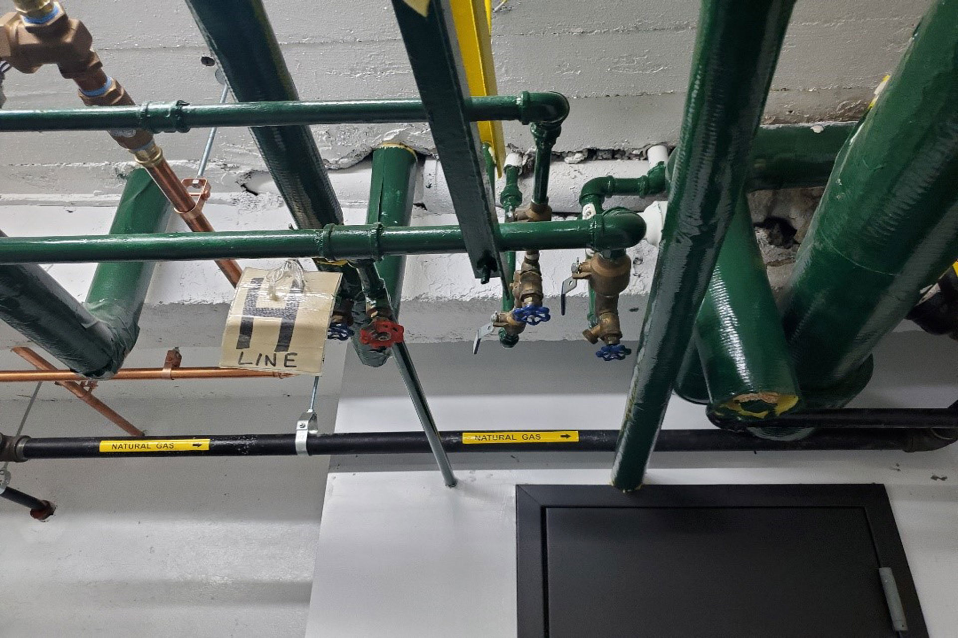 <p>New gas main throughout the cellar. Existing individual gas lines were removed.</p>
