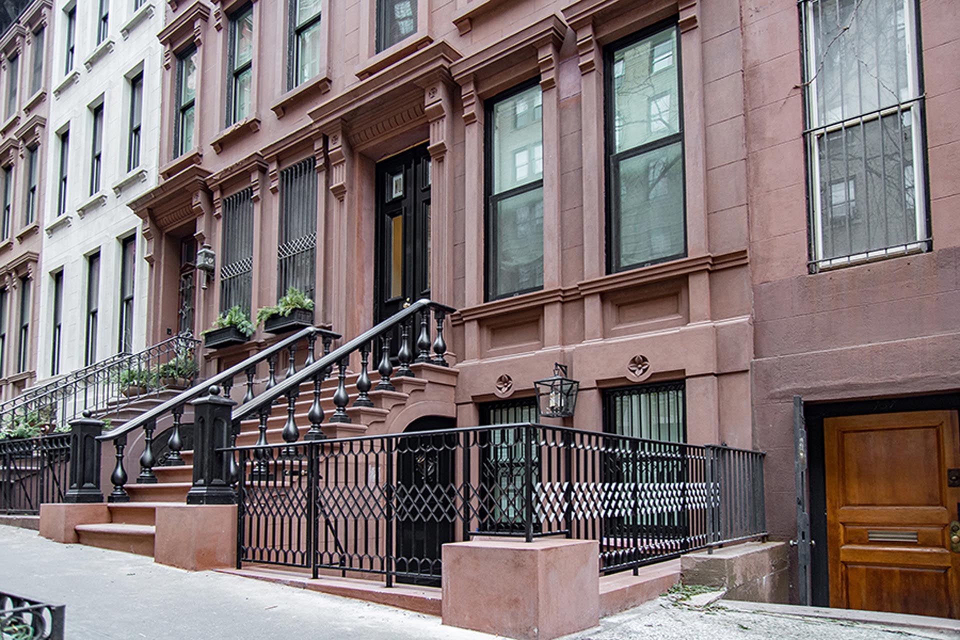 <p>The restoration included the addition of historically accurate door enframements, window headers, sills, decorative paneling, and flower rondels.</p>
