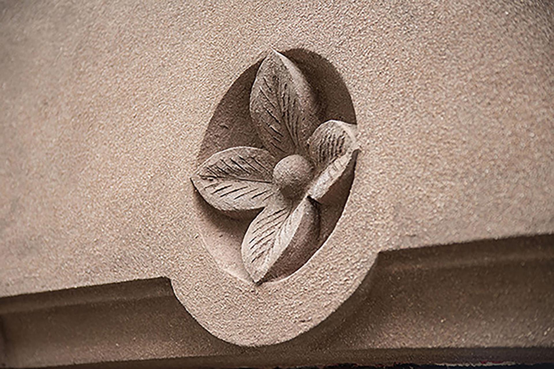 <p>Detail of a hand-sculpted flower rondel.</p>

