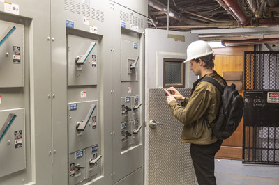 Rand Employee inspecting meters