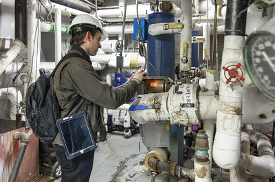 Project Engineer, Andrew Briguet performing a building evaluation.