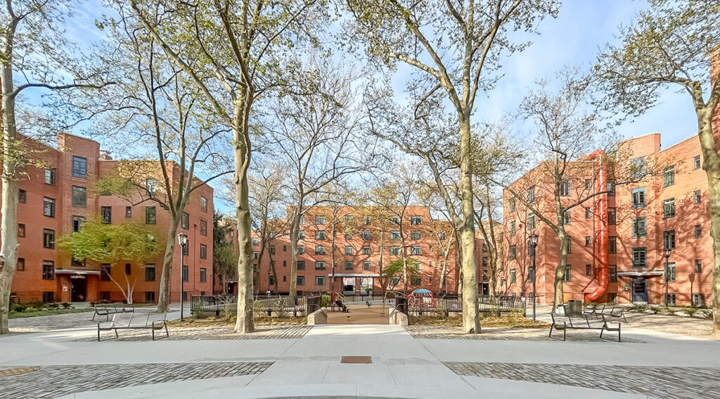 View of restored historic buildings at Harlem River Houses, a 1930s New Deal-era public housing development in Harlem, New York City. Restoration by RAND Engineering & Architecture, DPC and project team honored with a 2025 Lucy G. Moses Preservation Award.