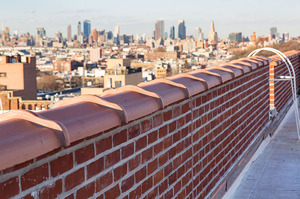 Hands-on Facade Inspection Safety Program (FISP) inspection by motorized scaffold in New York City.