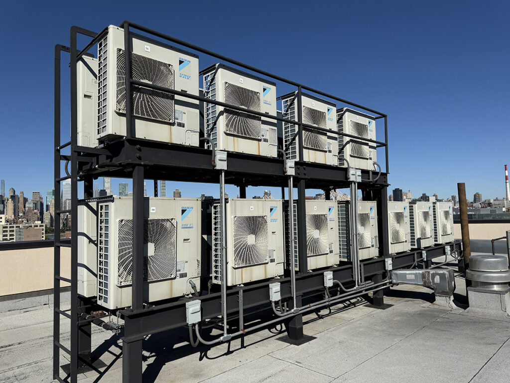 Heat pump units installed on the roof of a New York City building