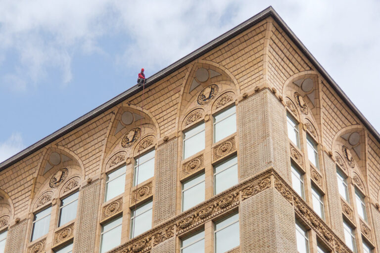Facade inspection by industrial rope access in New York City.